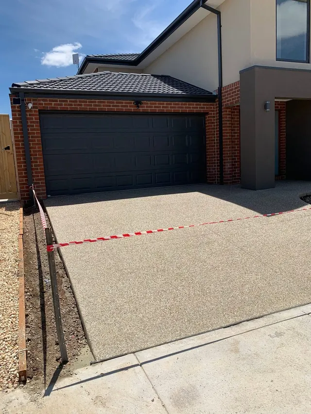 Charcoal exposed aggregate driveway